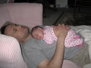 Daughter Vivienne sleeping on her Dad.